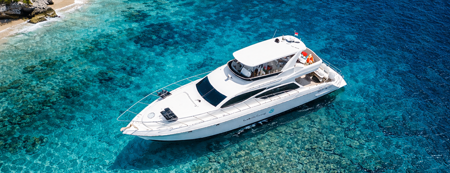 Rent a luxury private yacht in Bali on crystal-clear turquoise water